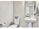 Clean powder room with pedestal sink and modern fixtures at 1575 W 68Th Ave, Denver, CO 80221