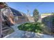 Landscaped backyard features a well-manicured lawn with a patio, perfect for outdoor relaxation and entertainment at 1866 S Pennsylvania St, Denver, CO 80210