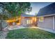 Backyard offers outdoor string lights and landscaping. This exterior is perfect for relaxing and entertaining at 1866 S Pennsylvania St, Denver, CO 80210