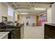 Unfinished basement features exposed ceilings, red brick accents, modern laundry, and neutral storage at 1866 S Pennsylvania St, Denver, CO 80210