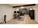 Finished basement office area features a decorative beam, light flooring, and neutral decor at 1866 S Pennsylvania St, Denver, CO 80210