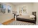 Charming bedroom with a built-in bookcase, hardwood floors, and a bright atmosphere from the natural light at 1866 S Pennsylvania St, Denver, CO 80210