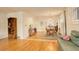 Open-concept dining room with hardwood floors, stylish lighting, and plenty of space for entertaining guests at 1866 S Pennsylvania St, Denver, CO 80210