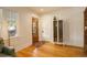 Bright entryway with hardwood floors, natural light, and a charming vintage cabinet at 1866 S Pennsylvania St, Denver, CO 80210