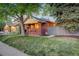 Lovely brick home with a well-maintained lawn and side access to the backyard at 1866 S Pennsylvania St, Denver, CO 80210