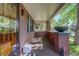 Inviting front porch with brick accents, a stylish planter, and a cozy seating area at 1866 S Pennsylvania St, Denver, CO 80210
