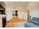 Spacious living room with hardwood floors, a fireplace, and an open layout leading to the dining area at 1866 S Pennsylvania St, Denver, CO 80210