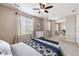 Bright bedroom with a ceiling fan, windows, and neutral decor at 25466 E 4Th Pl, Aurora, CO 80018