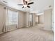 A spacious bedroom with neutral tones, ample natural light, and plush carpeting for ultimate comfort at 25466 E 4Th Pl, Aurora, CO 80018
