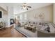 Spacious living room with hardwood floors, fireplace, and a cozy seating area at 25466 E 4Th Pl, Aurora, CO 80018