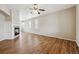 Spacious living room featuring fireplace, ceiling fan, and large windows allowing for natural light at 25466 E 4Th Pl, Aurora, CO 80018