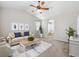 Comfortable living room with ceiling fan, neutral decor, and ample natural light at 25466 E 4Th Pl, Aurora, CO 80018