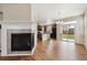 Open-concept living area features fireplace, hardwood floors, and access to the backyard at 25466 E 4Th Pl, Aurora, CO 80018