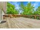 View of a large wooden deck with a natural wood finish, overlooking a private backyard at 13134 Deneb Dr, Lone Tree, CO 80124