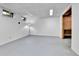 Spacious unfinished basement with a large open area, small windows, and a standing lamp at 13134 Deneb Dr, Lone Tree, CO 80124
