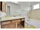 Bathroom includes single vanity, toilet, tub and shower combination, and neutral tile at 13134 Deneb Dr, Lone Tree, CO 80124