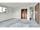 Bedroom with soft carpeting, natural light, and convenient closet access at 13134 Deneb Dr, Lone Tree, CO 80124