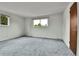 Bedroom features soft carpeting, natural light, and closet access at 13134 Deneb Dr, Lone Tree, CO 80124