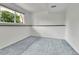 Bright bedroom featuring neutral walls, carpeted floor, and window bringing in natural light at 13134 Deneb Dr, Lone Tree, CO 80124