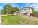 Well-maintained two story home featuring an attached garage, mature tree, and landscaped front yard at 13134 Deneb Dr, Lone Tree, CO 80124