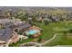 Stunning aerial view of clubhouse, pool, and golf course in the community at 7750 S Buchanan Way, Aurora, CO 80016