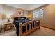 Cozy bedroom featuring natural wood accents and comfortable furnishings at 7750 S Buchanan Way, Aurora, CO 80016