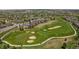 Beautiful aerial view of lush golf course and luxury homes within a thriving community at 7750 S Buchanan Way, Aurora, CO 80016