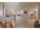 Open-concept floor plan showcasing the living room, kitchen, and staircase, ideal for modern living at 7750 S Buchanan Way, Aurora, CO 80016