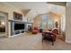 Inviting living room featuring a fireplace, comfortable seating, and plenty of natural light at 7750 S Buchanan Way, Aurora, CO 80016