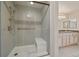 Modern shower with glass door and convenient built in bench at 7750 S Buchanan Way, Aurora, CO 80016