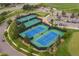 Aerial view of the community's tennis and pickleball courts with lush landscaping at 7750 S Buchanan Way, Aurora, CO 80016