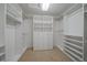 Large walk-in closet with custom shelving and ample storage space at 7750 S Buchanan Way, Aurora, CO 80016