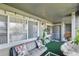 View of the shaded balcony featuring comfortable seating and ambient lighting at 1404 Whitehall Dr # C, Longmont, CO 80504