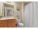 Bathroom featuring a single sink vanity and a shower with a curtain at 1404 Whitehall Dr # C, Longmont, CO 80504