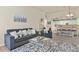 Bright living room with a view of the dining area and kitchen, featuring comfortable seating at 1404 Whitehall Dr # C, Longmont, CO 80504