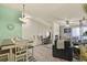 Spacious open-concept view of the living room, dining area, and kitchen with modern decor at 1404 Whitehall Dr # C, Longmont, CO 80504