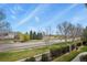 Neighborhood street view from the property highlighting surrounding landscaping at 1404 Whitehall Dr # C, Longmont, CO 80504