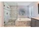 Beautiful bathroom featuring a large soaking tub, glass shower, and elegant fixtures at 3343 W 109Th Cir, Westminster, CO 80031