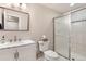 Well-maintained bathroom with marble vanity, a shower with glass doors, and neutral tiling and paint at 3343 W 109Th Cir, Westminster, CO 80031