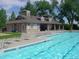 Community pool with sun loungers and umbrellas, offering a relaxing space for residents at 3343 W 109Th Cir, Westminster, CO 80031