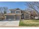Beautiful two-story home with brick and siding, features a large front lawn and a three-car garage at 3343 W 109Th Cir, Westminster, CO 80031