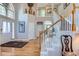Inviting foyer with hardwood floors, staircase, and high ceilings, creating a spacious entrance at 3343 W 109Th Cir, Westminster, CO 80031