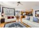 Open-concept living room flows into the kitchen and dining area, with hardwood floors and plenty of seating at 3343 W 109Th Cir, Westminster, CO 80031