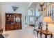 Bright living room featuring a china cabinet and a staircase, creating a welcoming atmosphere at 3343 W 109Th Cir, Westminster, CO 80031