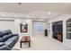Spacious basement living room with a comfortable couch, a modern TV, and soft, neutral carpeting at 3343 W 109Th Cir, Westminster, CO 80031