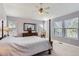 Spacious main bedroom with a four poster bed, ceiling fan, and bright natural light at 3343 W 109Th Cir, Westminster, CO 80031
