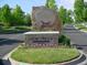 Entrance to Legacy Ridge Golf Course featuring stone signage, vibrant flowers, and landscaped surroundings at 3343 W 109Th Cir, Westminster, CO 80031