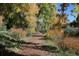 Scenic walking path surrounded by colorful foliage, inviting residents to enjoy the outdoors at 3343 W 109Th Cir, Westminster, CO 80031