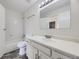 Bathroom featuring tile floor, toilet, sink with vanity, and tub with shower at 1758 S Ensenada St, Aurora, CO 80017