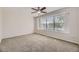 Bright bedroom with carpet, ceiling fan and large window with blinds at 1758 S Ensenada St, Aurora, CO 80017